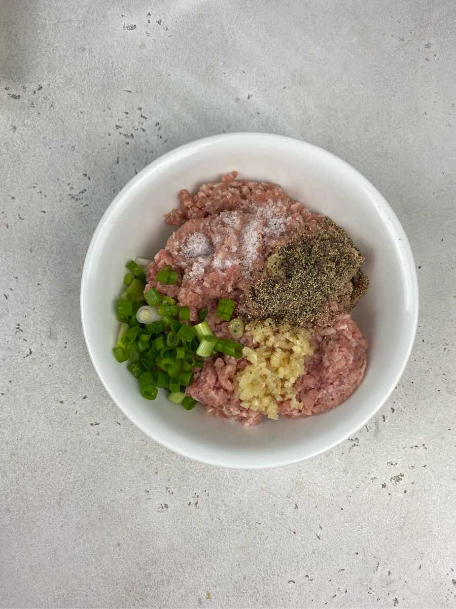 mix ground pork and season with salt and pepper to make easy sotanghon meatballs