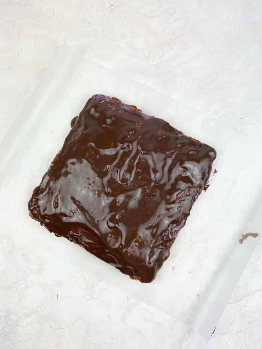 add melted chocolate on to of tube brownies
