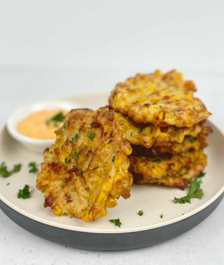 air fryer corn fritters served with sriracha mayo