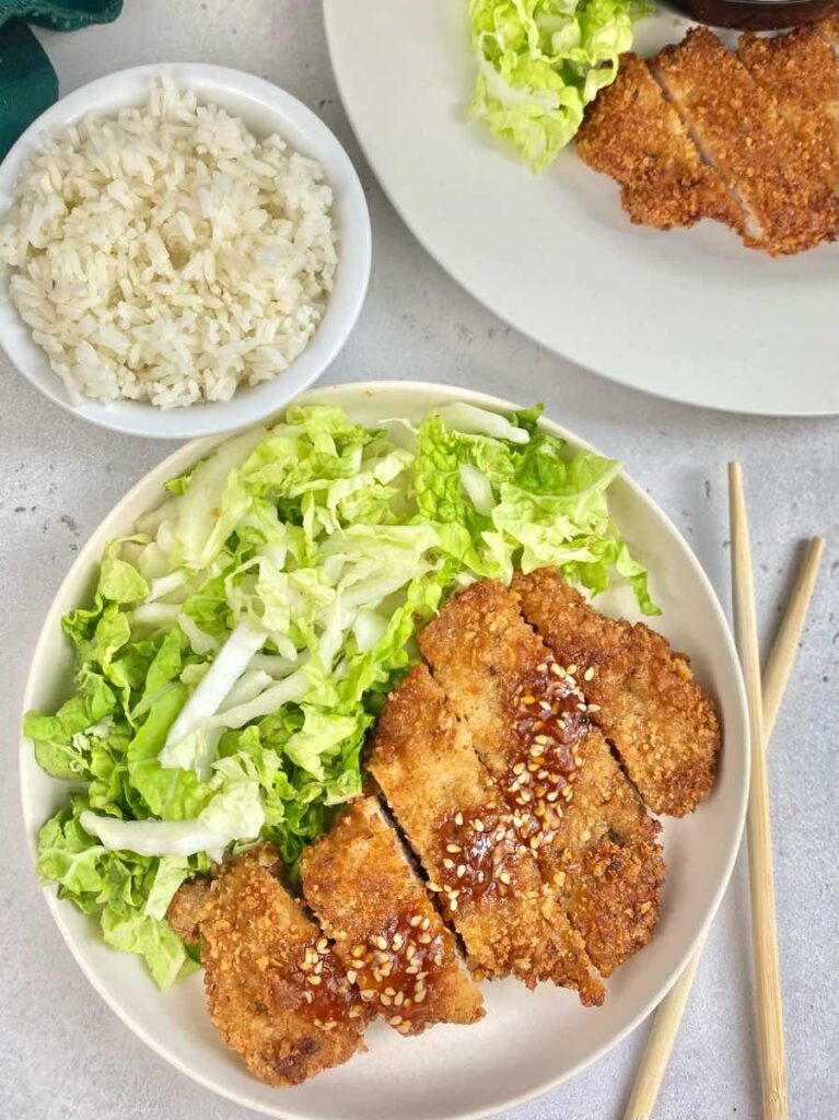 serve tonkatsu pork chops with shredded cabbage