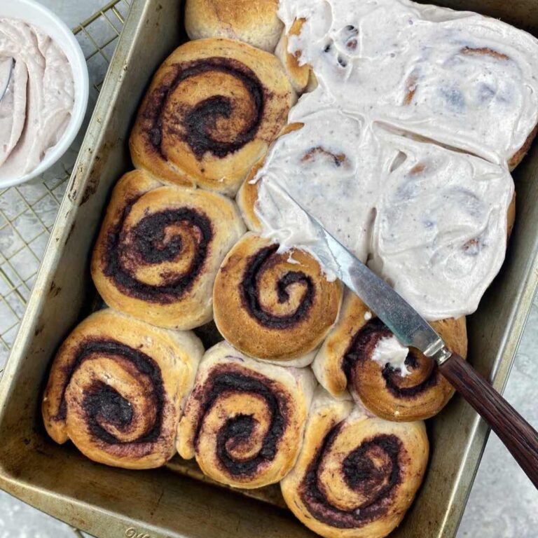 ube cinnamon rolls topped with cream cheese