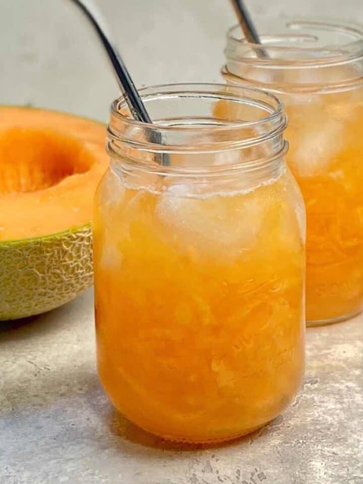 melon juice in a glass with straw