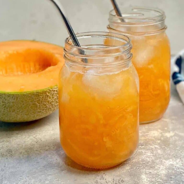 melon juice in a glass with straw