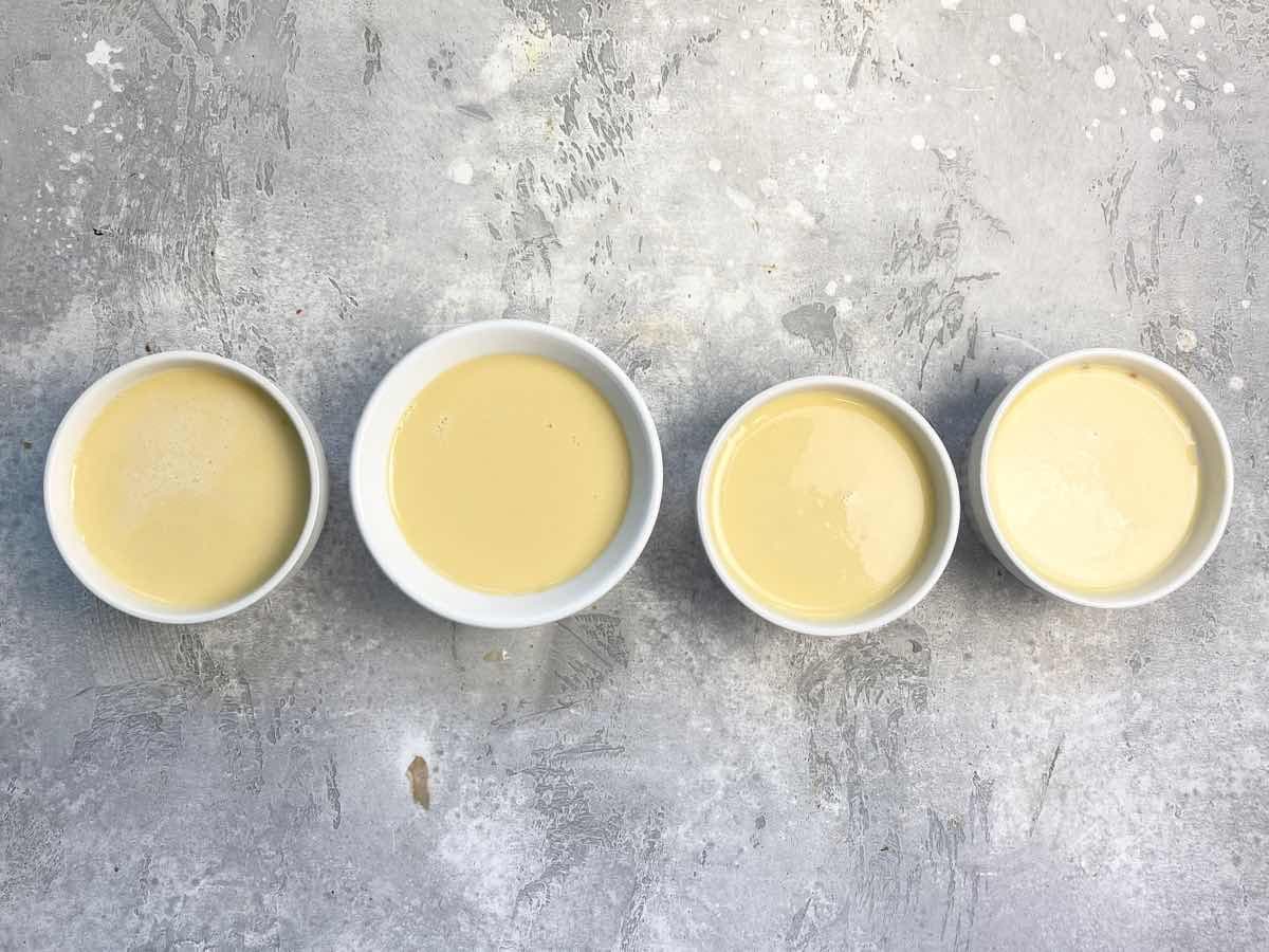 four ramekins filled with egg custard