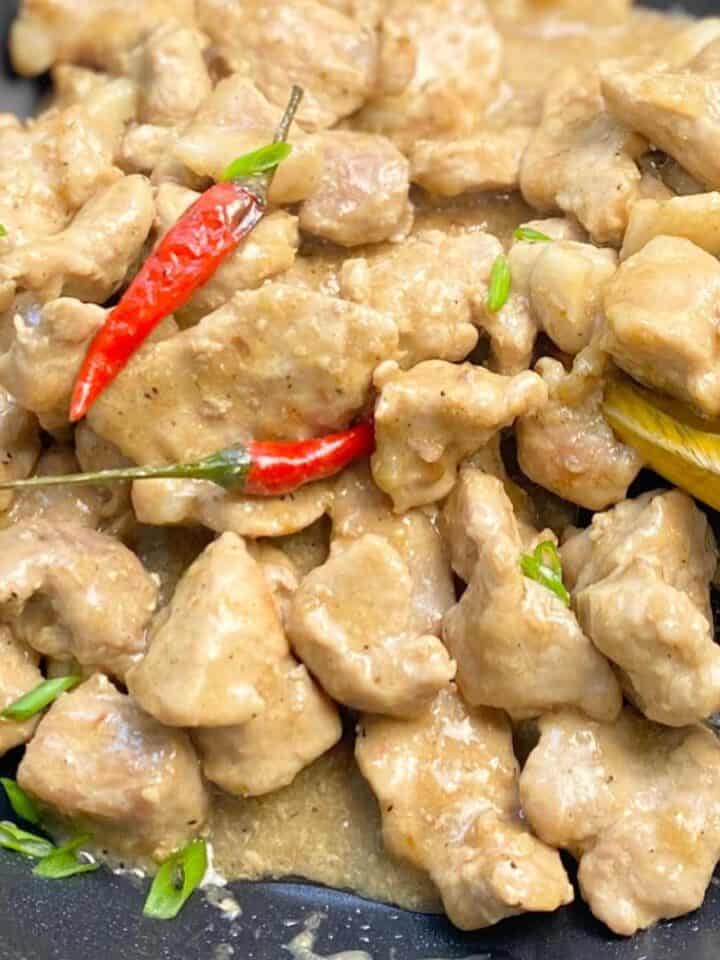 pork bicol express in a pan with red chilli