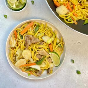 Pancit Canton Guisado in a plate top with lime