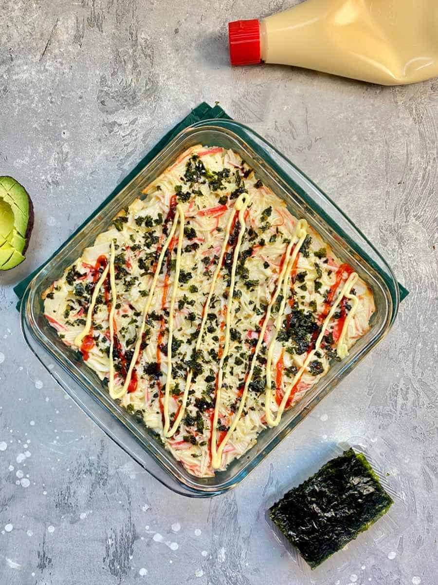 sushi bake casserole, featureing avocado and seaweed sheets 