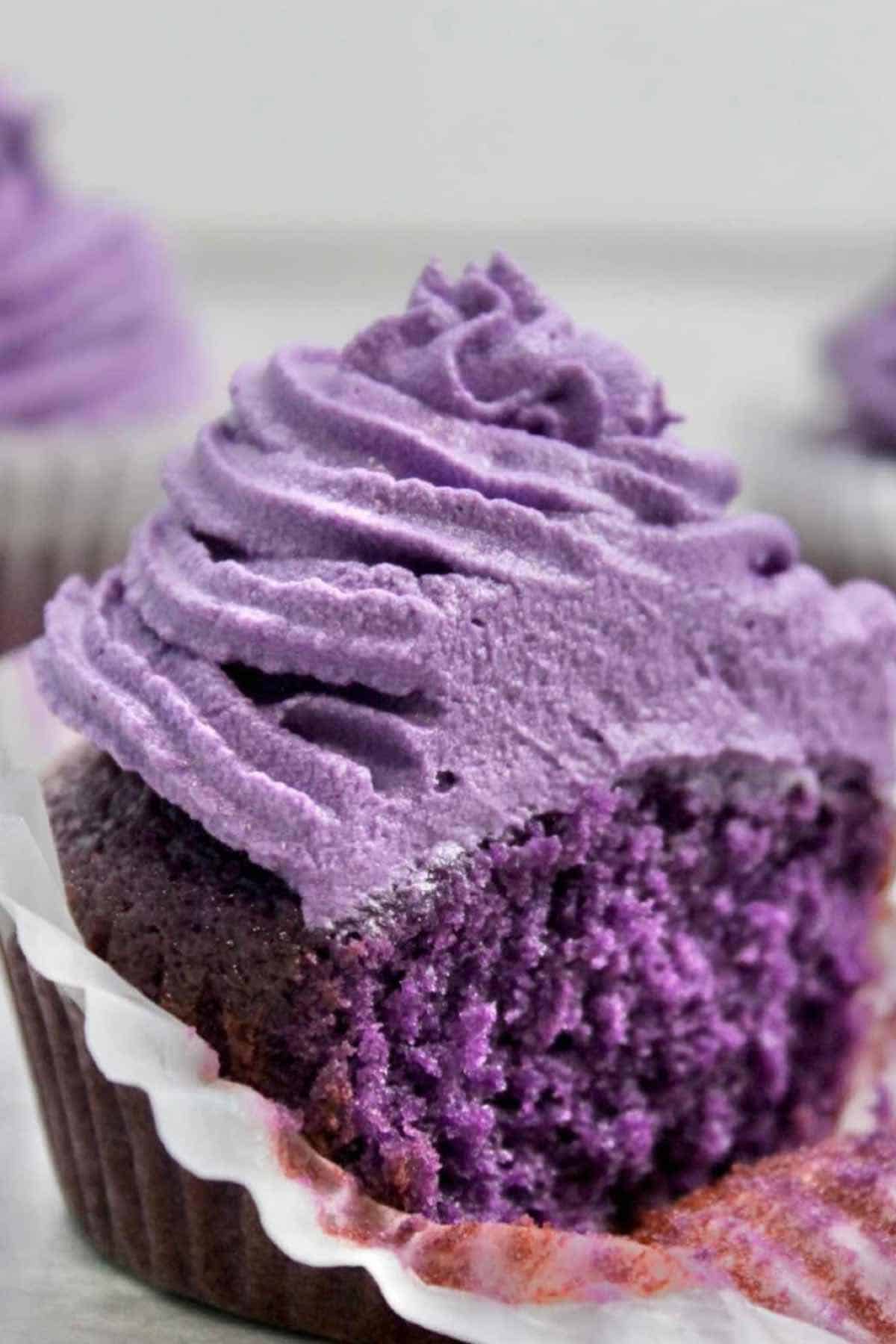 half eaten ube cupcakes with frosting
