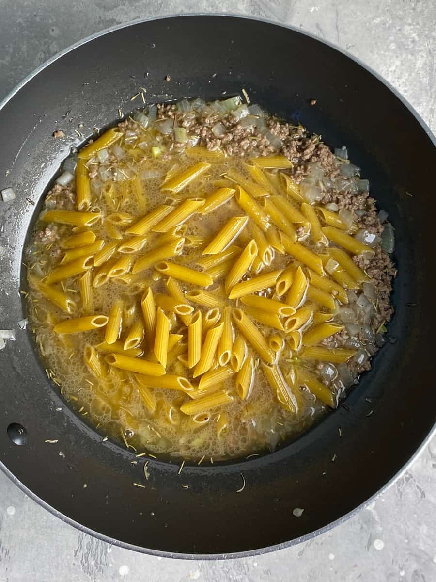 add broth and penne pasta