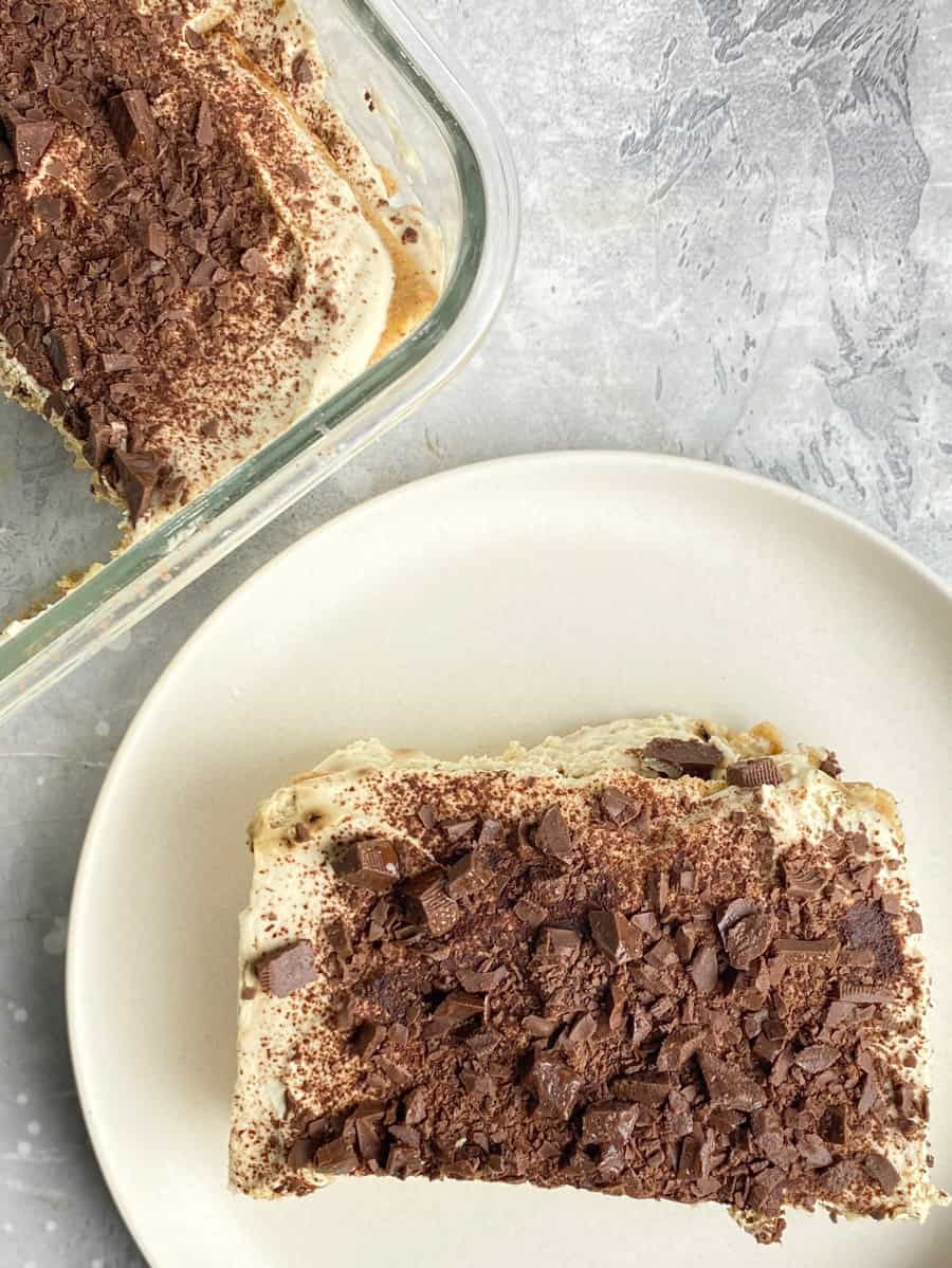 coffee graham float cake top with cocoa powder and chocolate