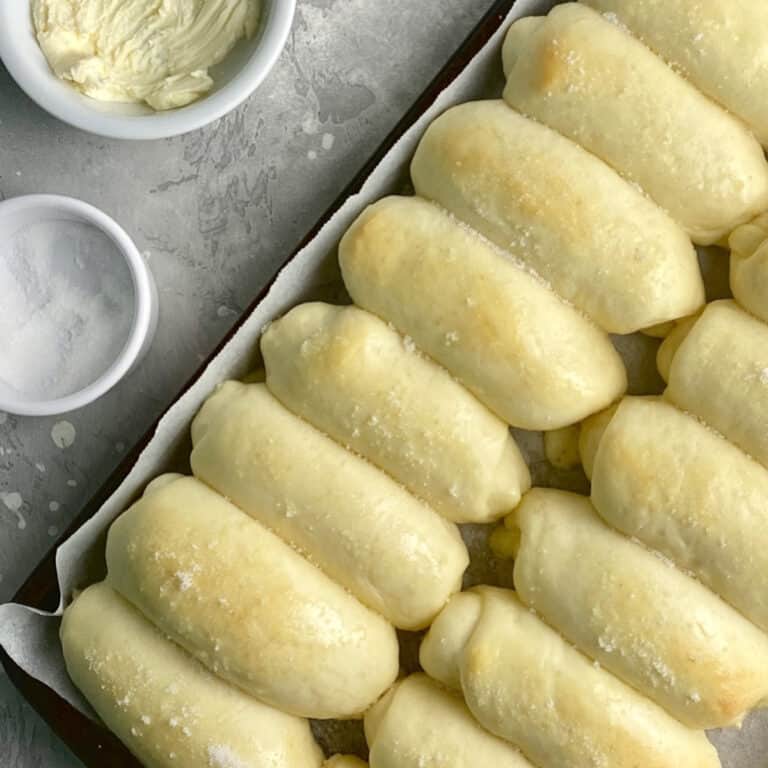 filipino cheese bread rolls in a baking pan