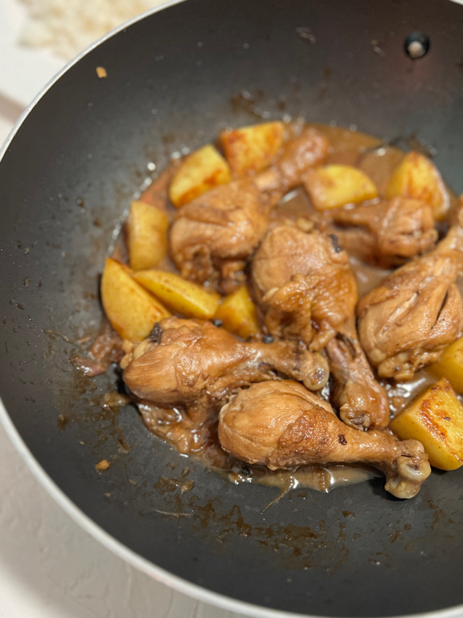cooked chicken adobo with potatoes in one pot