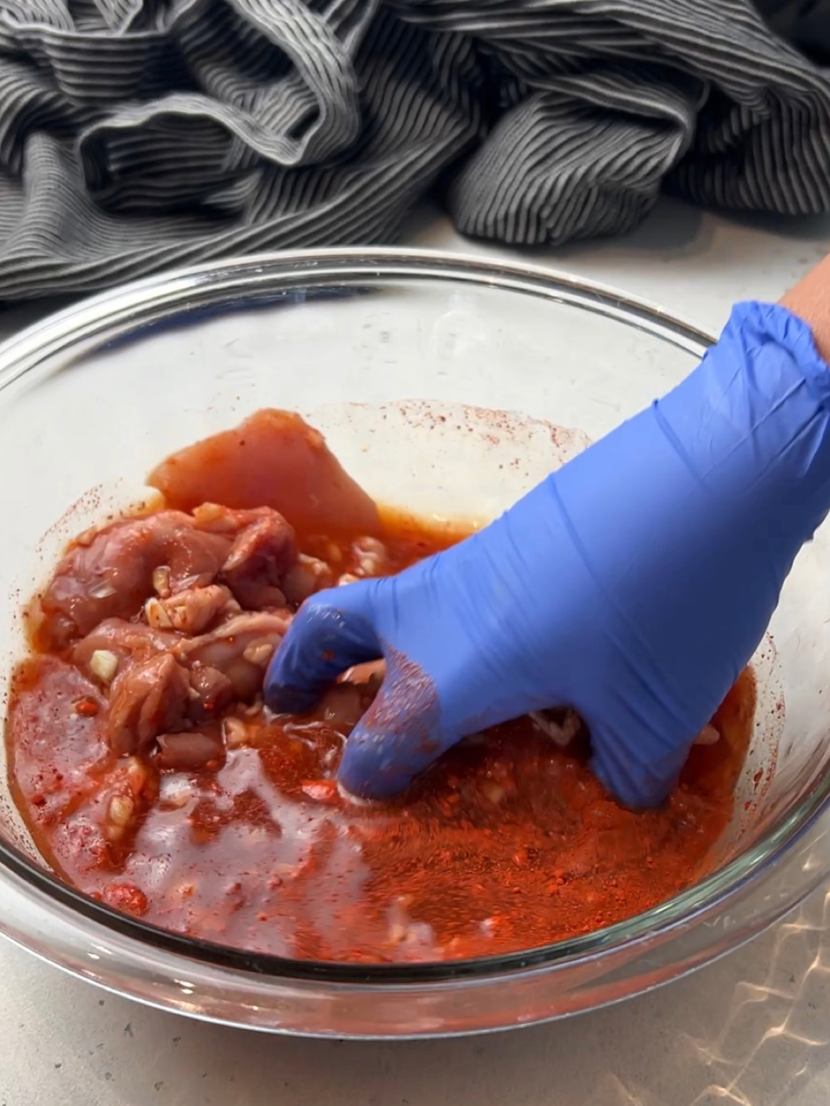 a bowl with orange color tocino sauce