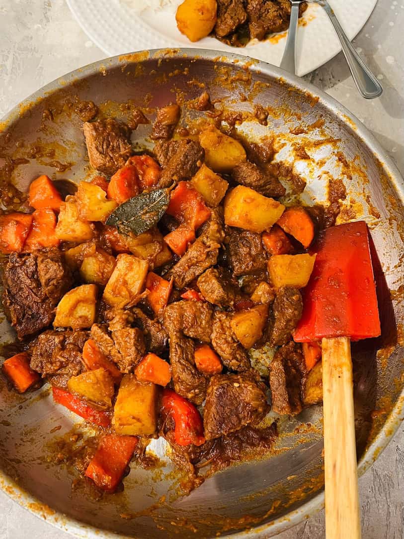 beef mechado in a pan