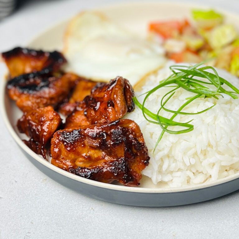 Chicken Tocino with rice and eggs on the plate