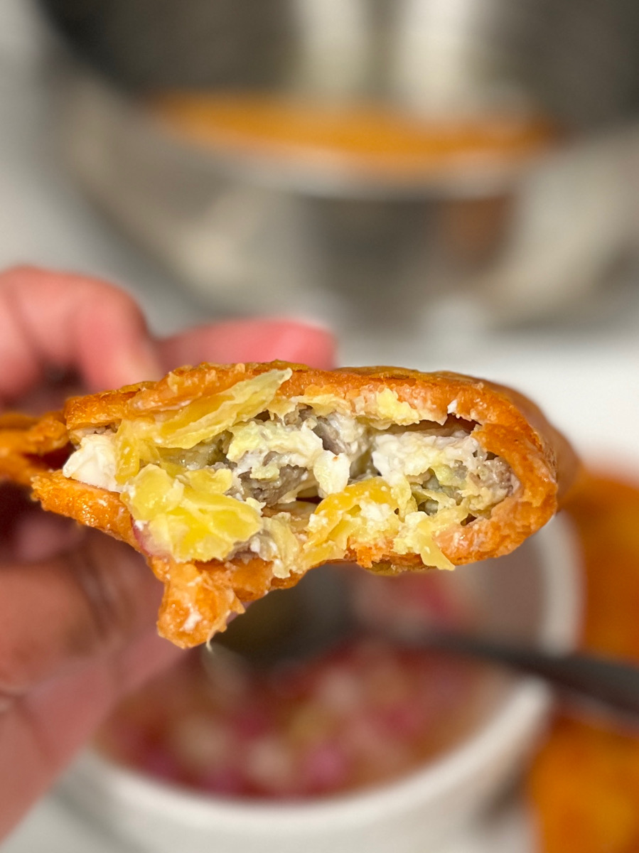 closeup photo of ilocos empanada and the fillings
