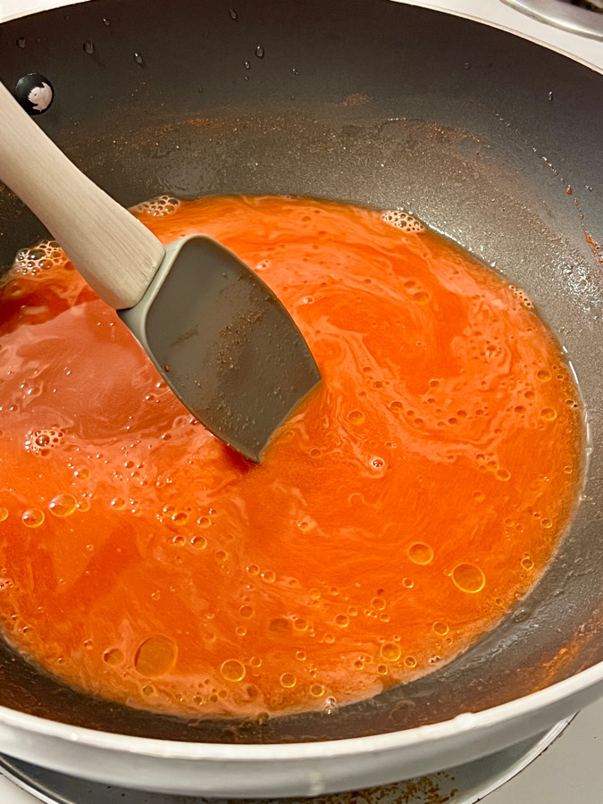step 1 dissolve annatto powder in boiling water